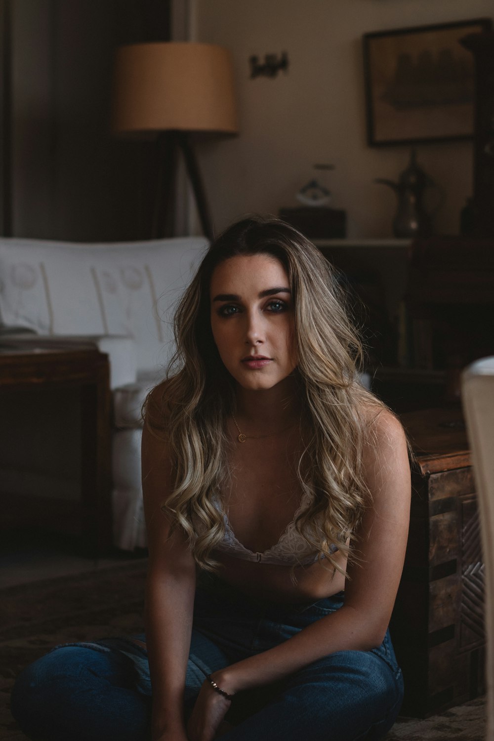 woman seated near sofa in room