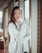 standing woman wearing white crew-neck sweater