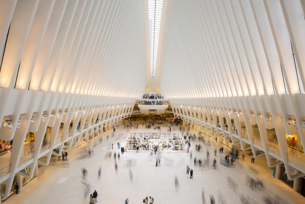 timelapse photography of people walking inside building