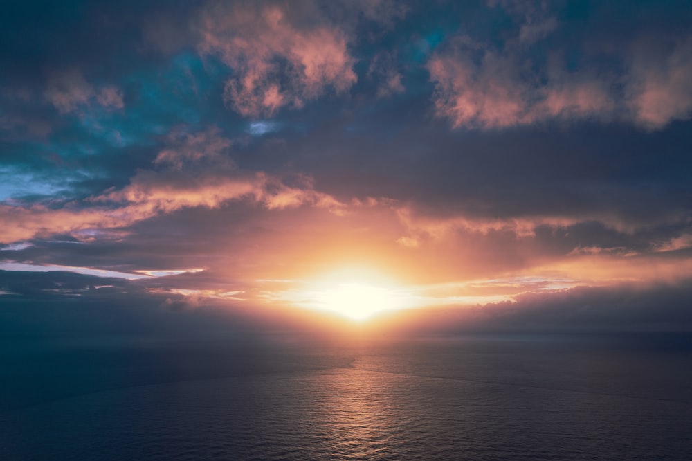 aerial photography of calm body of water during golden hour