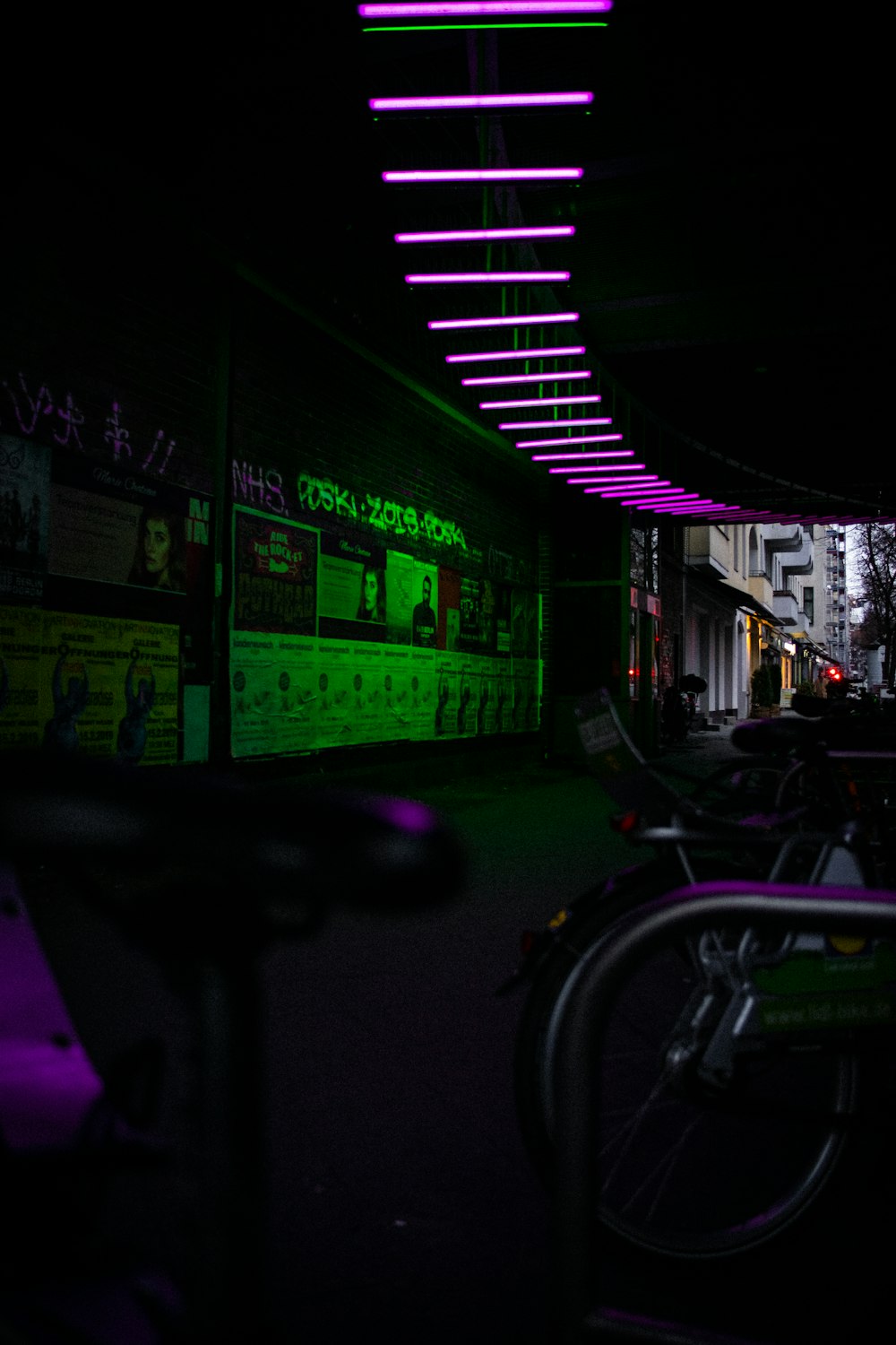 dim lighted room with green and purple lights