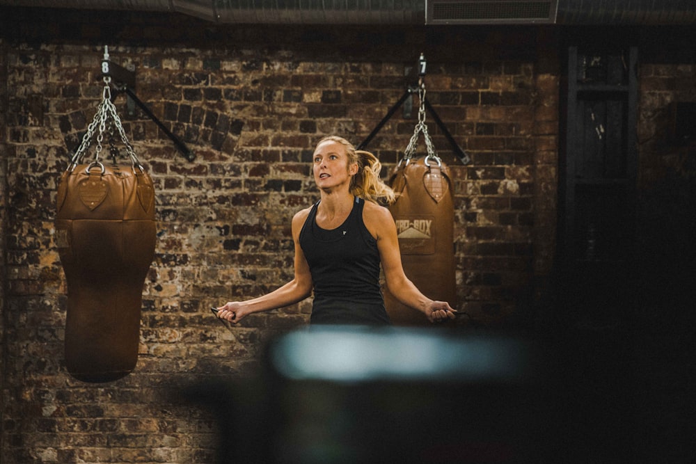 woman in black fitness top doing training