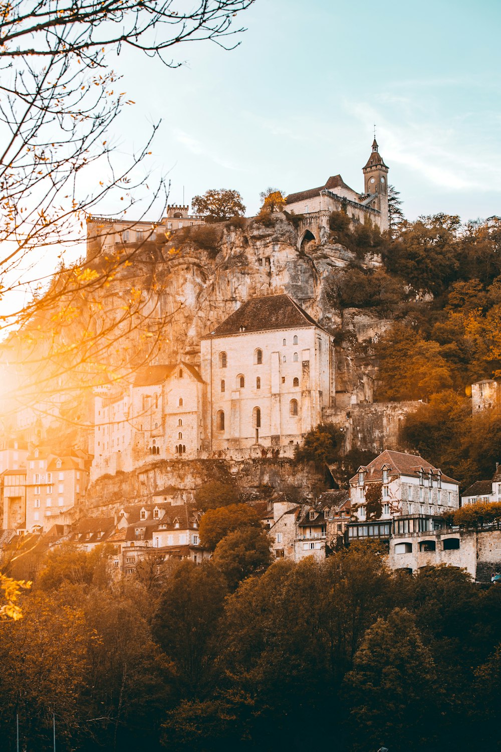 white concrete buildings and houses at a hill during daytime