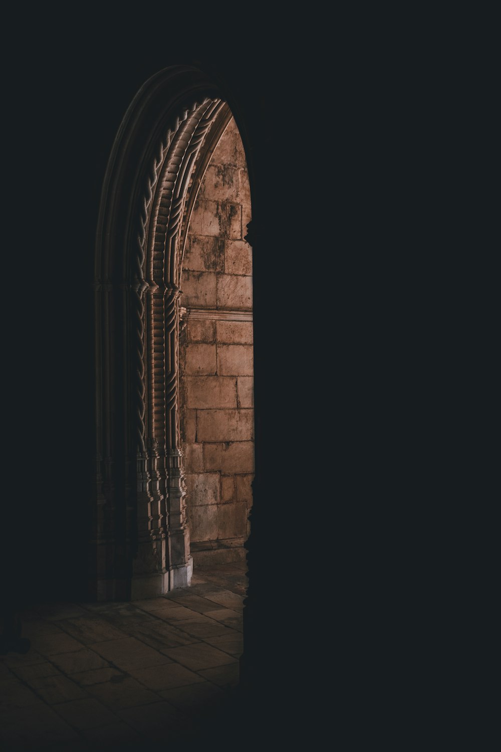 brown concrete arch pathway