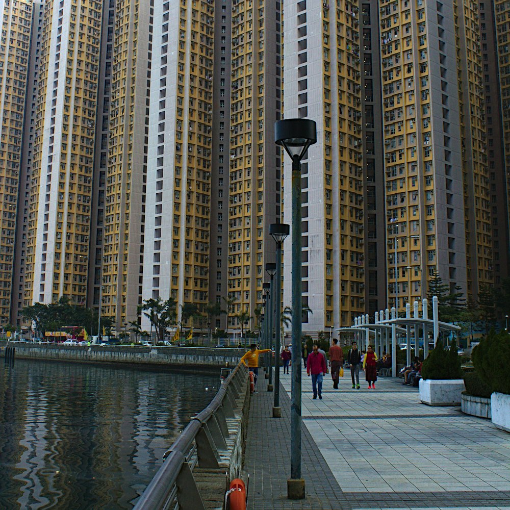 people walking near high-rise building during daytime