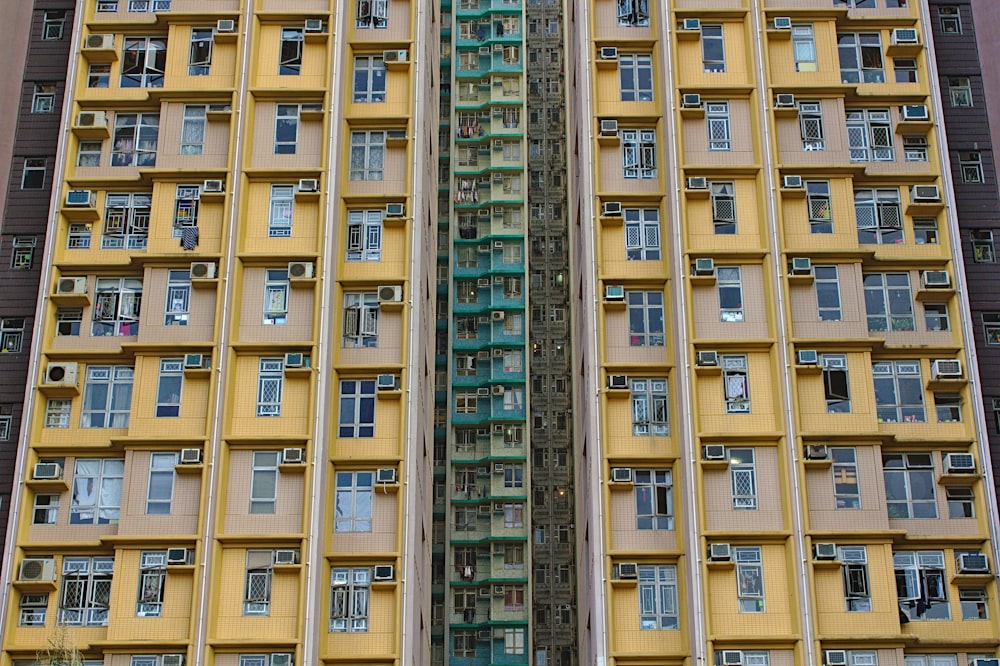 low-angle photography of yellow concrete building