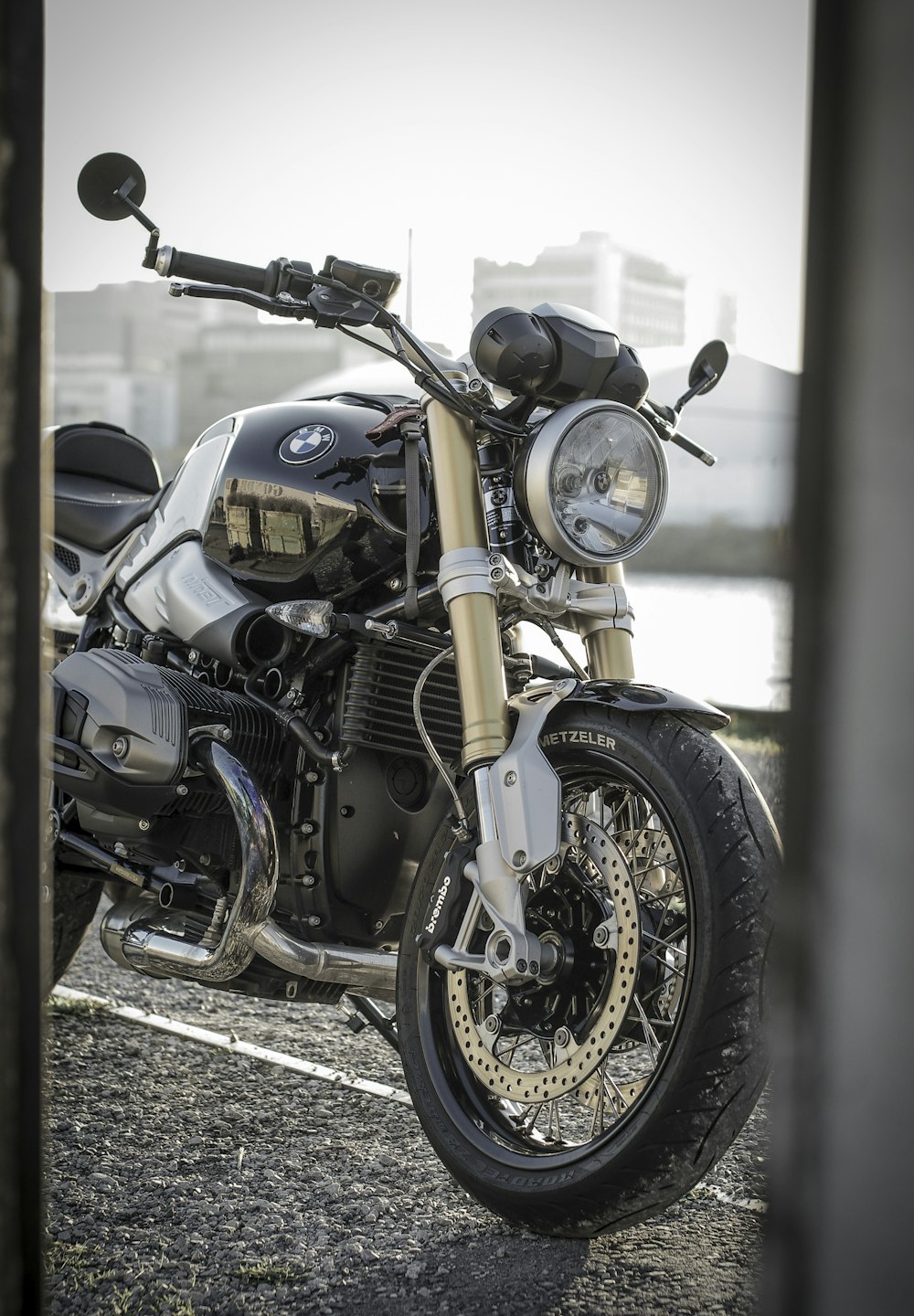 black BMW motorcycle parked near building