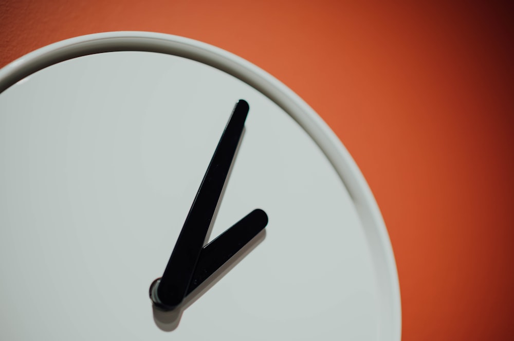 white and black wall clock