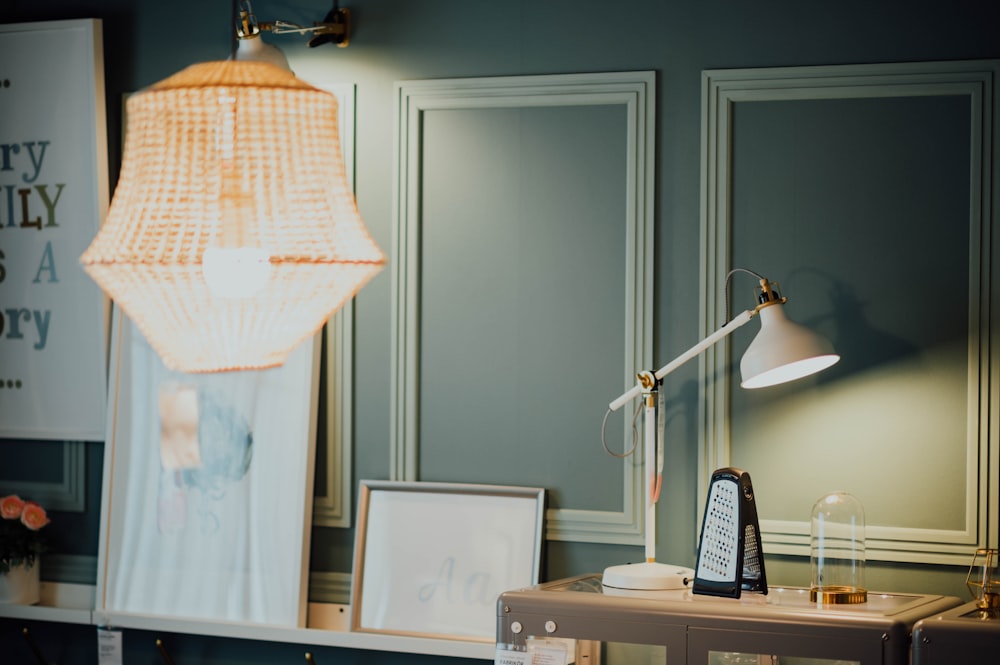 white reading lamp on table in room