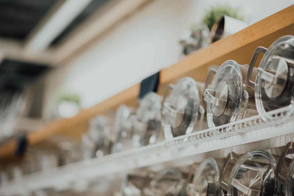 clear glass bottles on rack