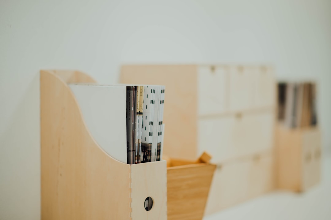 books in brown wooden organizer