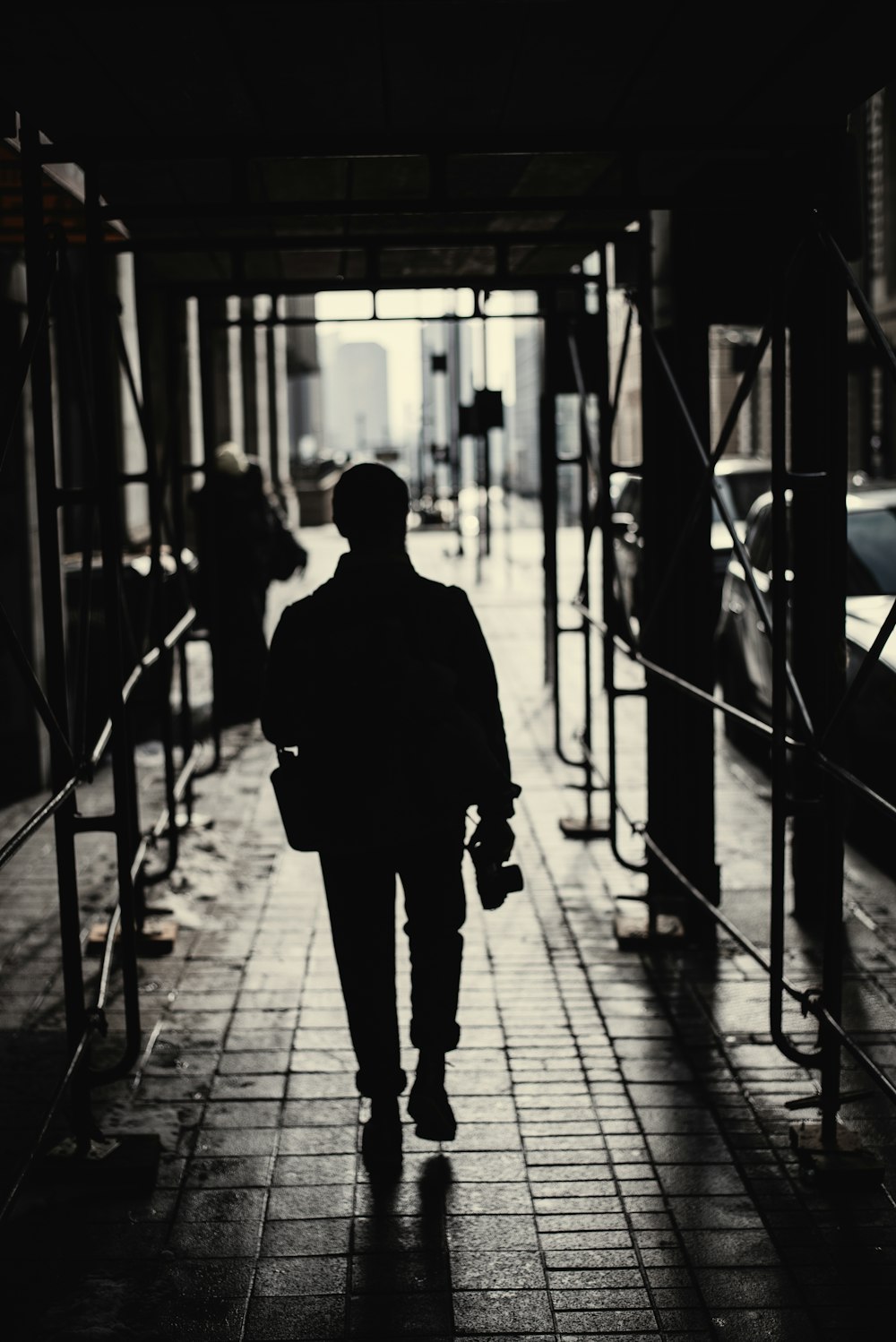 silhouette of woman walking on hallway