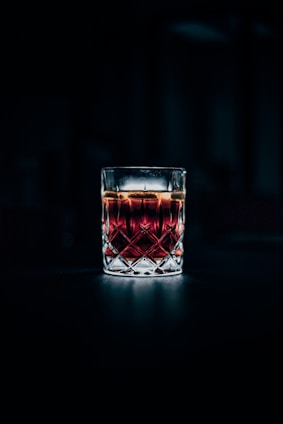 clear drinking glass filled with red liquid