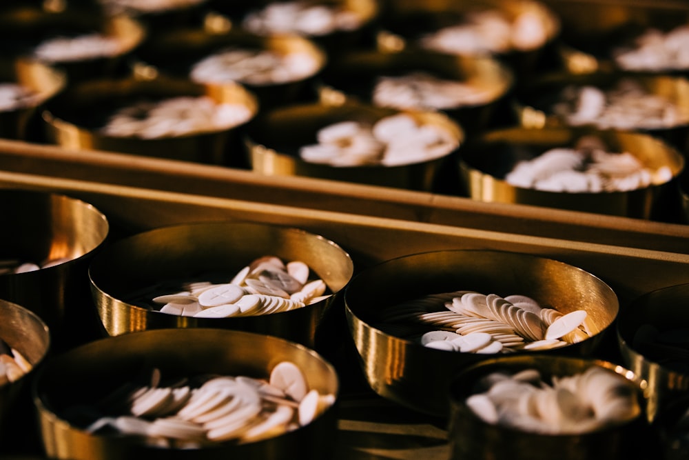 selective focus photography of coins on round container