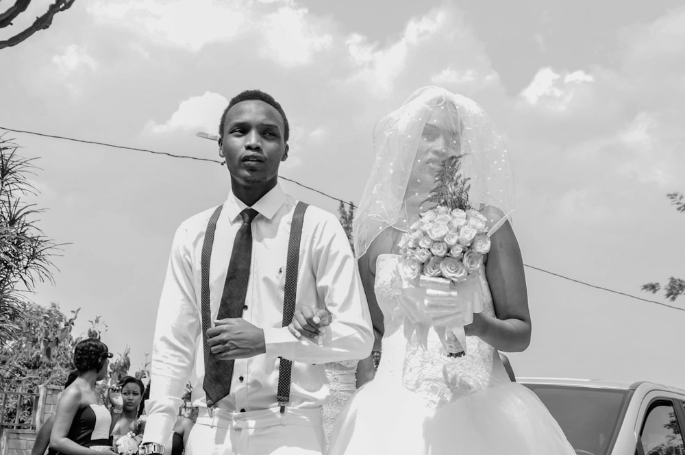 grayscale photo of newlywed couple