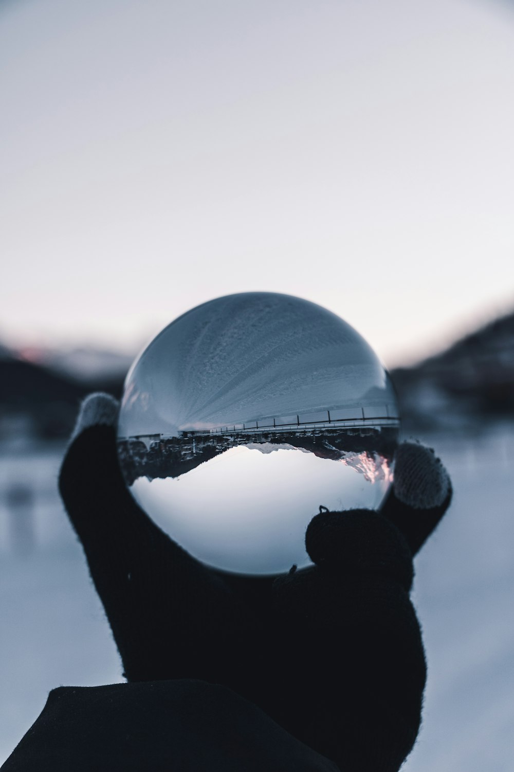 reflection of mountains in clear marble