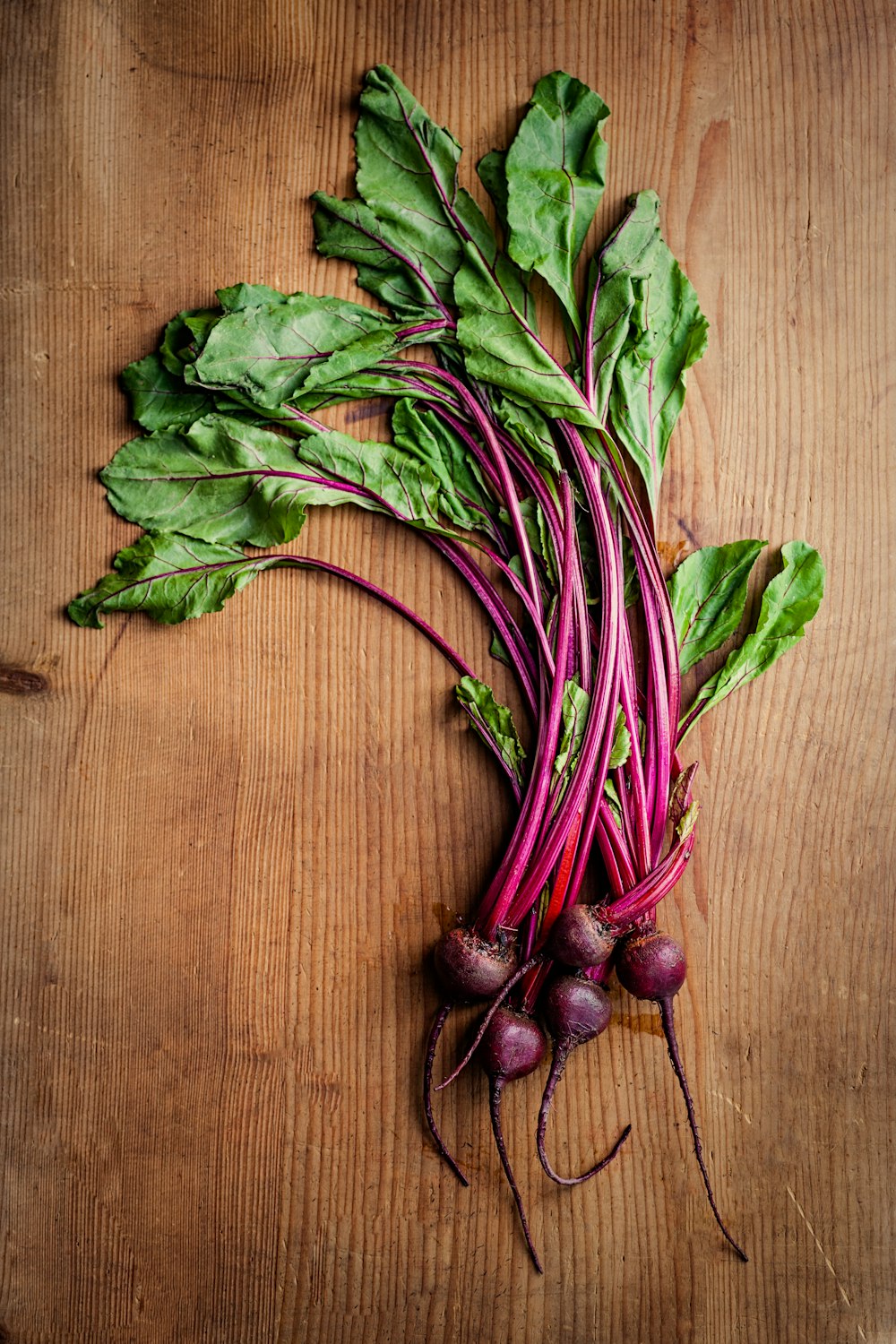 purple and green vegetables on brown surface