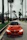 red BMW coupe parked at road