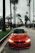 red BMW coupe parked at road