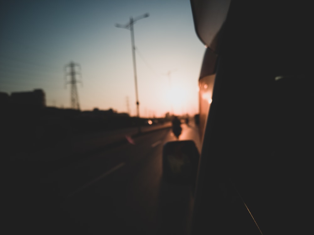 silhouette of cars on road during unset