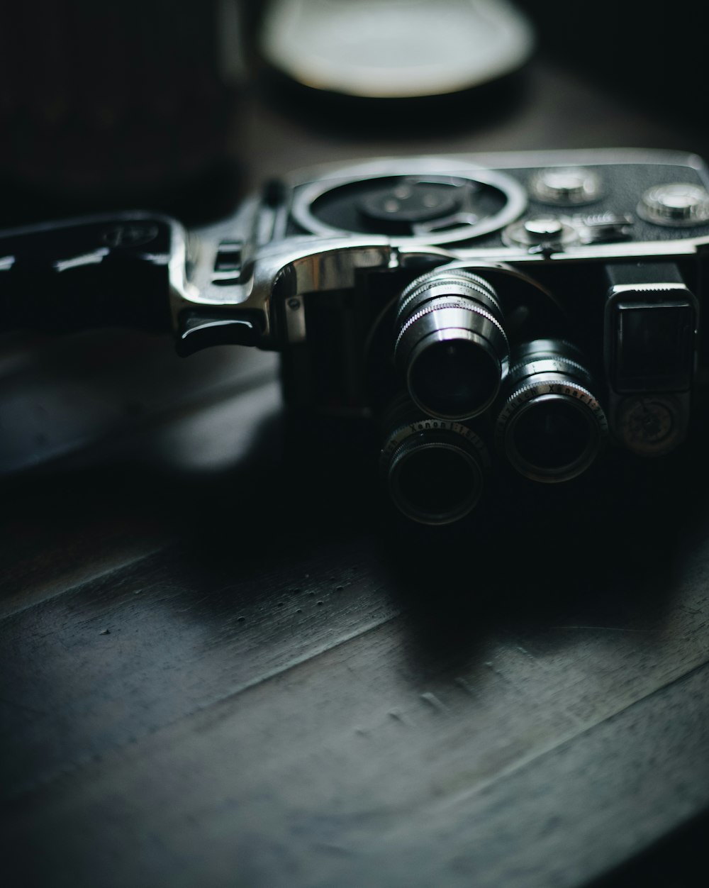 a camera sitting on top of a wooden table