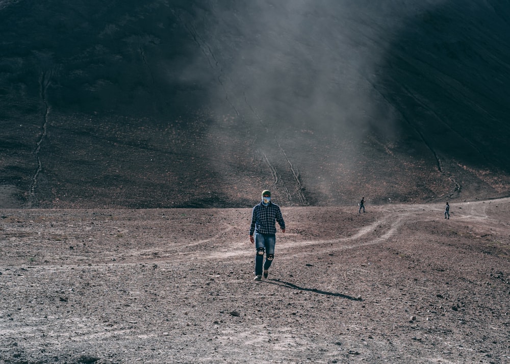 person walking on open field during daytime