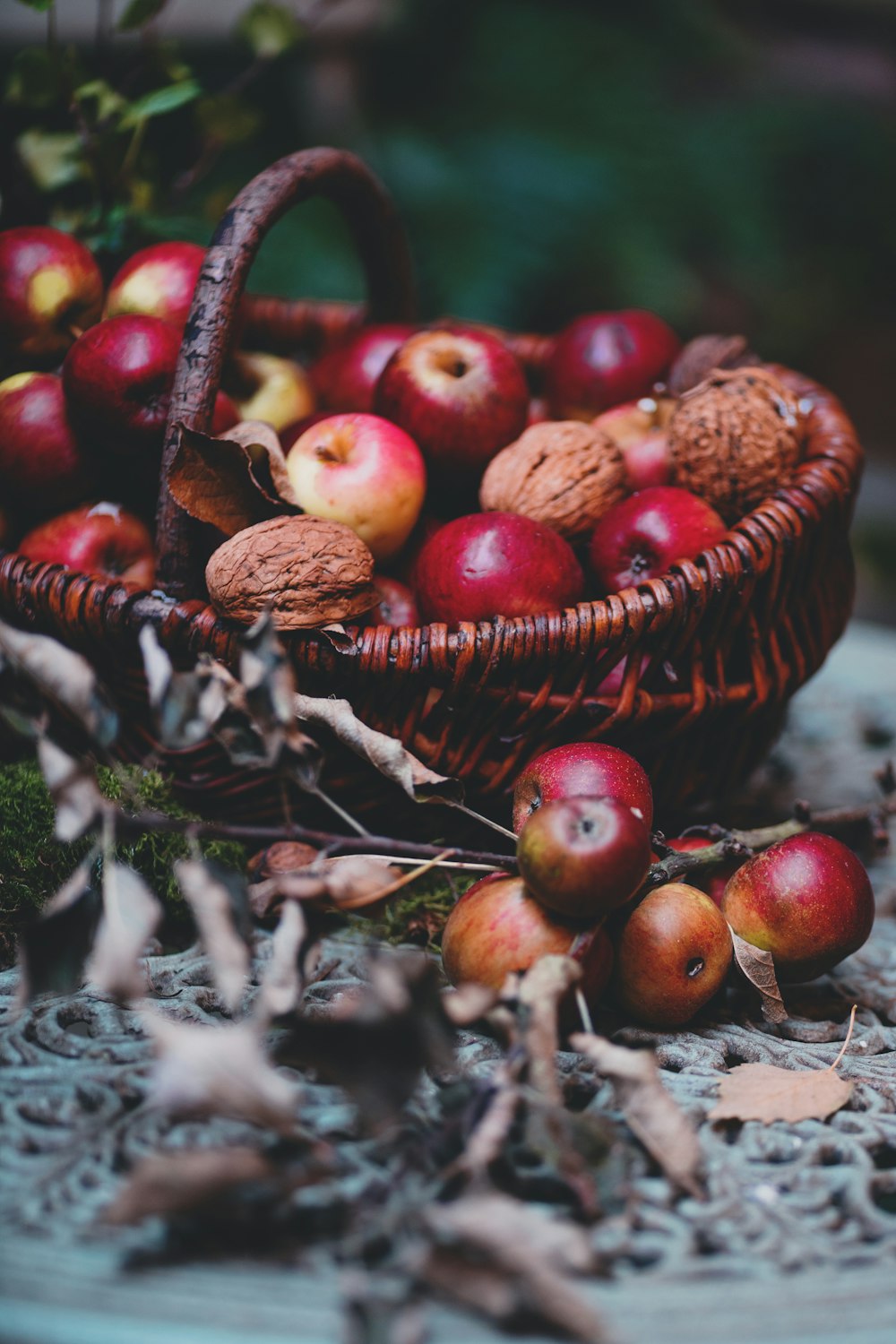 red apple fruits on brown wicker basket