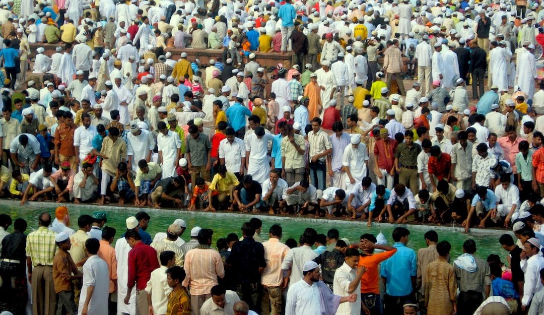 people standing and sitting on floor