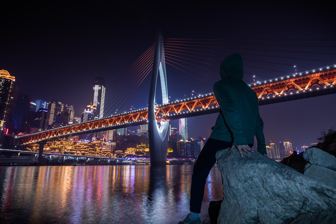 person sitting on rock during night time