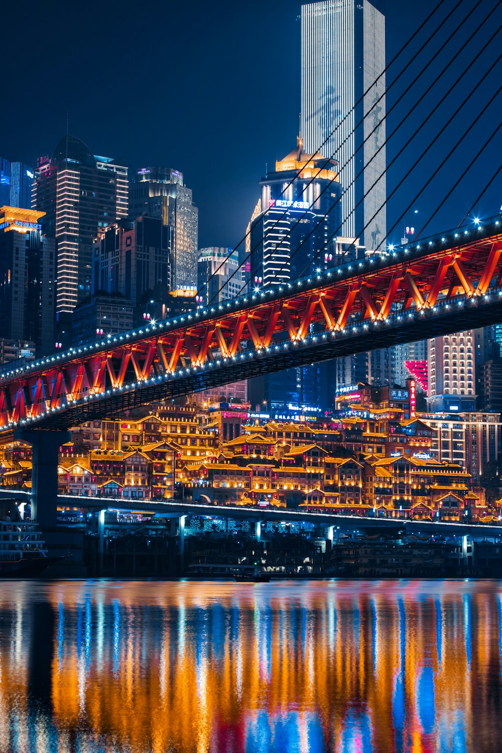 lighted bridge across calm water