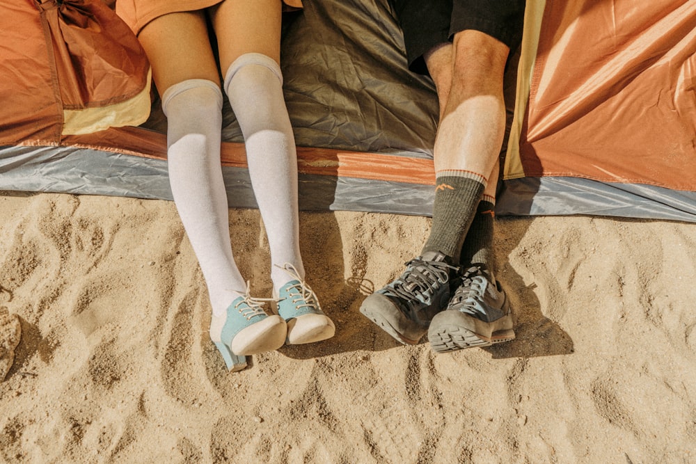 two person sitting inside tent at daytime