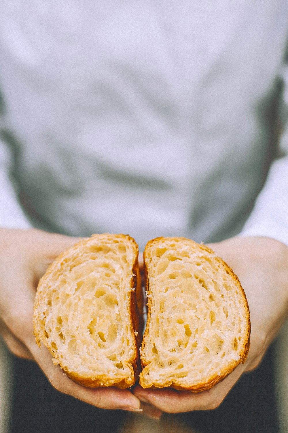 person holds two sliced bread