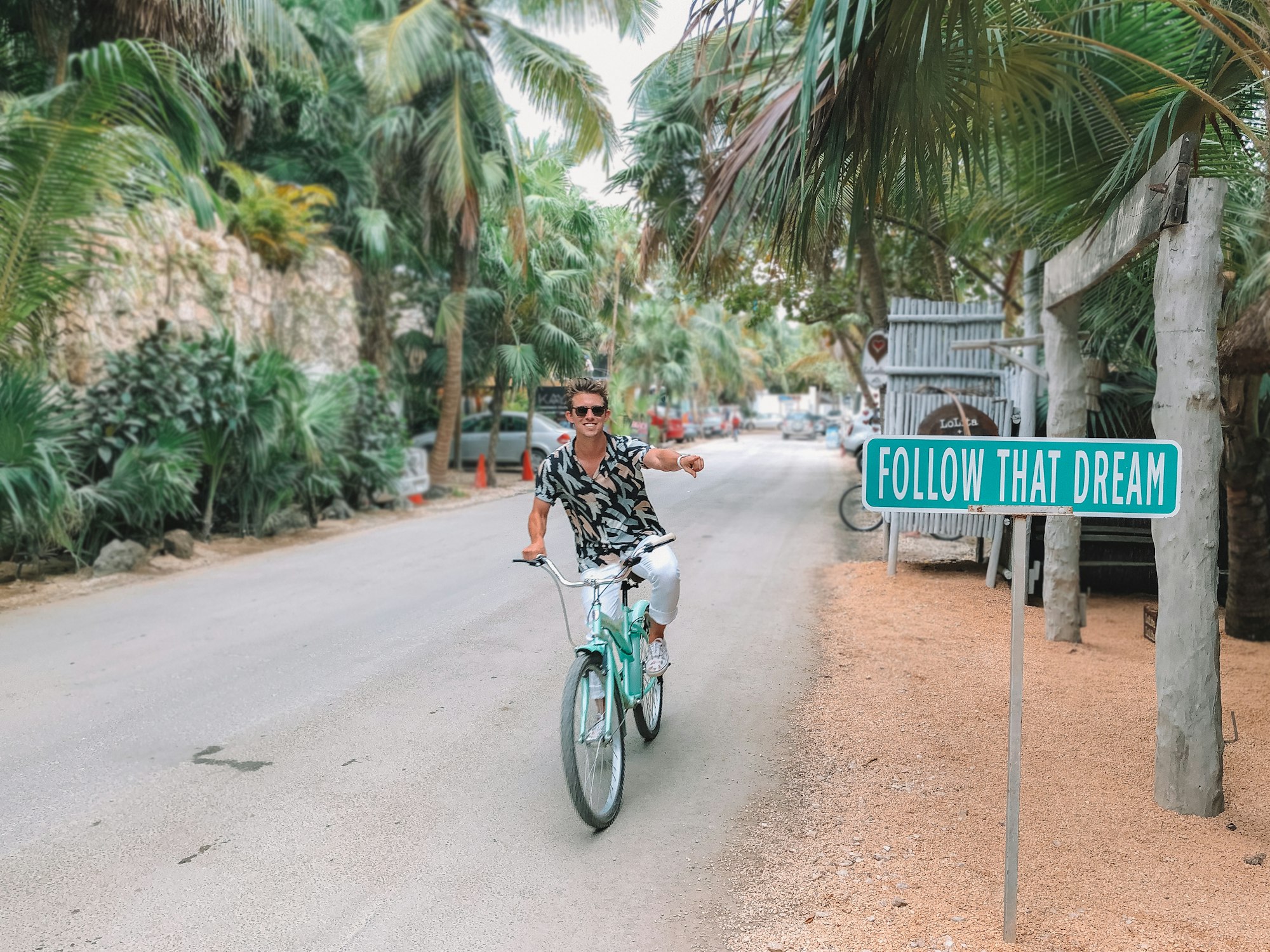 Entrepreneur Austin Distel bicycles in Tulum, Mexico past the Follow That Dream sign - just as many other digital nomads travel and blog about their island adventures.

Model: @Austindistel
https://www.instagram.com/austindistel/

Photographer: @breeandstephen
https://www.instagram.com/breeandstephen/

.
