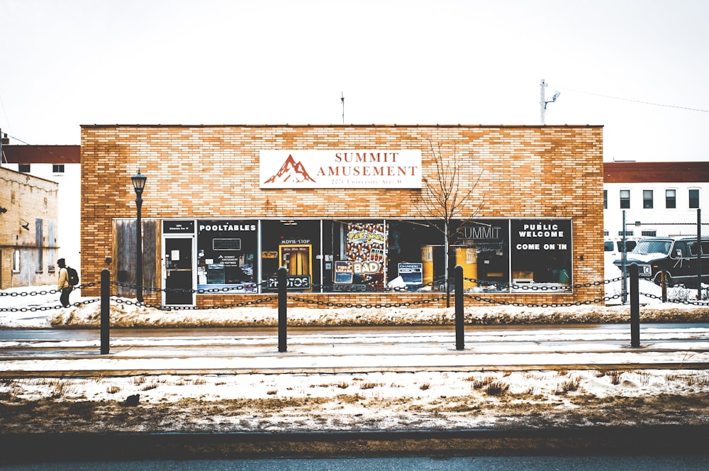 man walking infront of store front