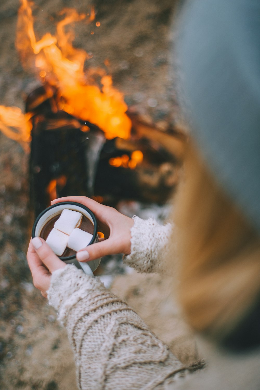 woman holding white mug