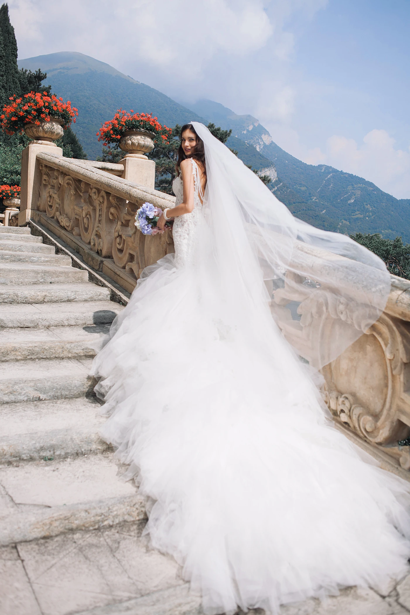 Wedding dress steaming services near me — A close-up of a bride looking at her reflection in a full-length mirror.