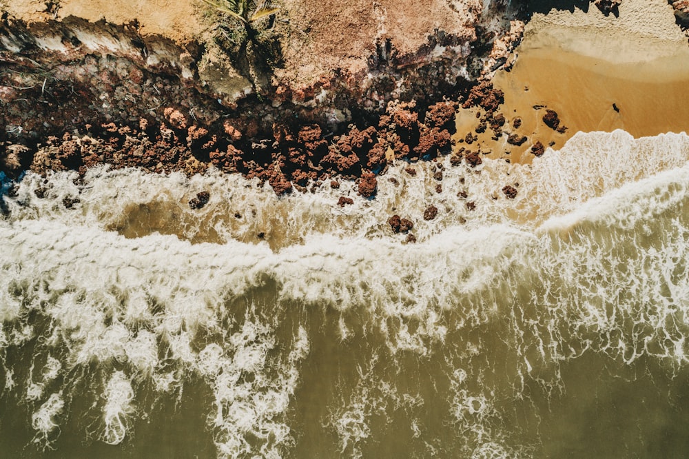 sea wave near beach cliff