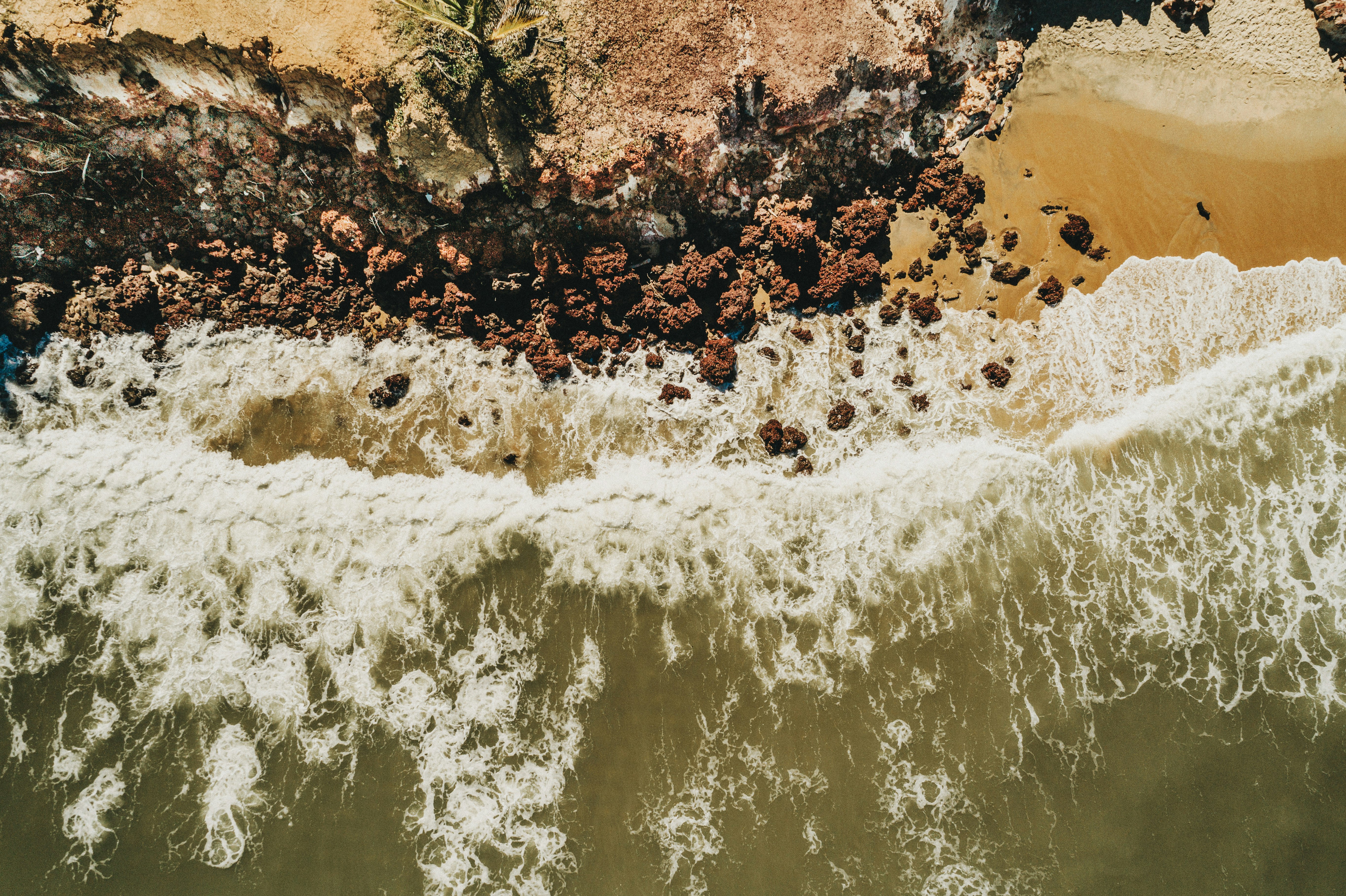 sea wave near beach cliff