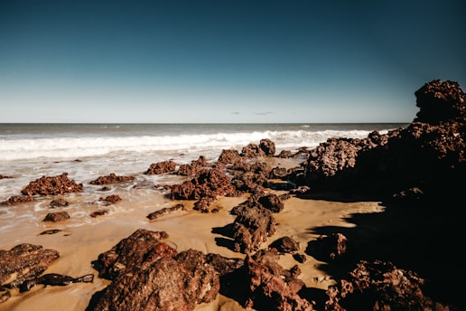stones on seashore during daytime