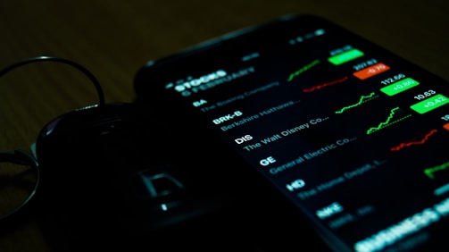 smartphone on brown wooden surface