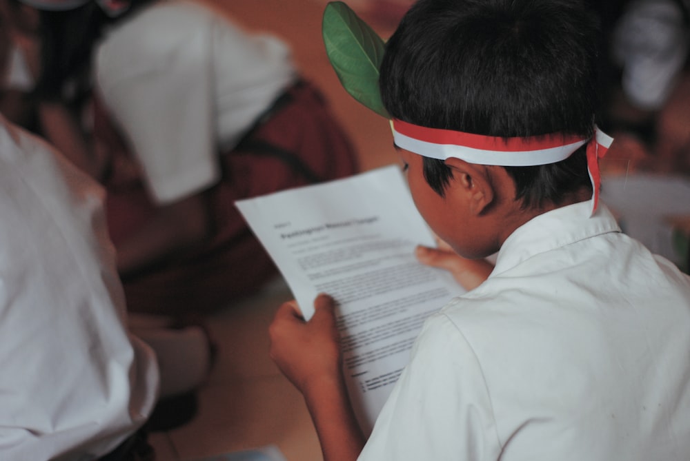 boy reading a paper