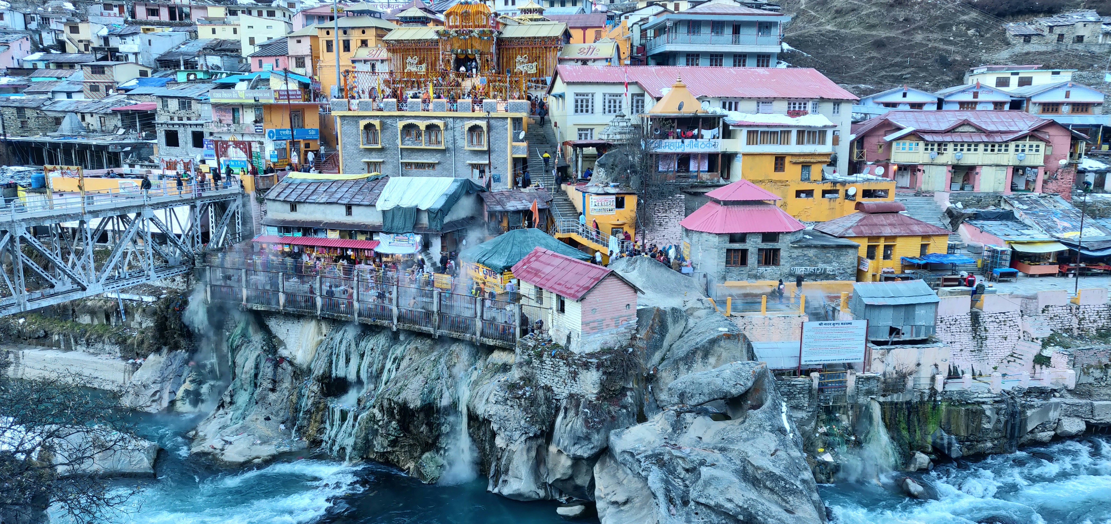 assorted-color houses beside body of water