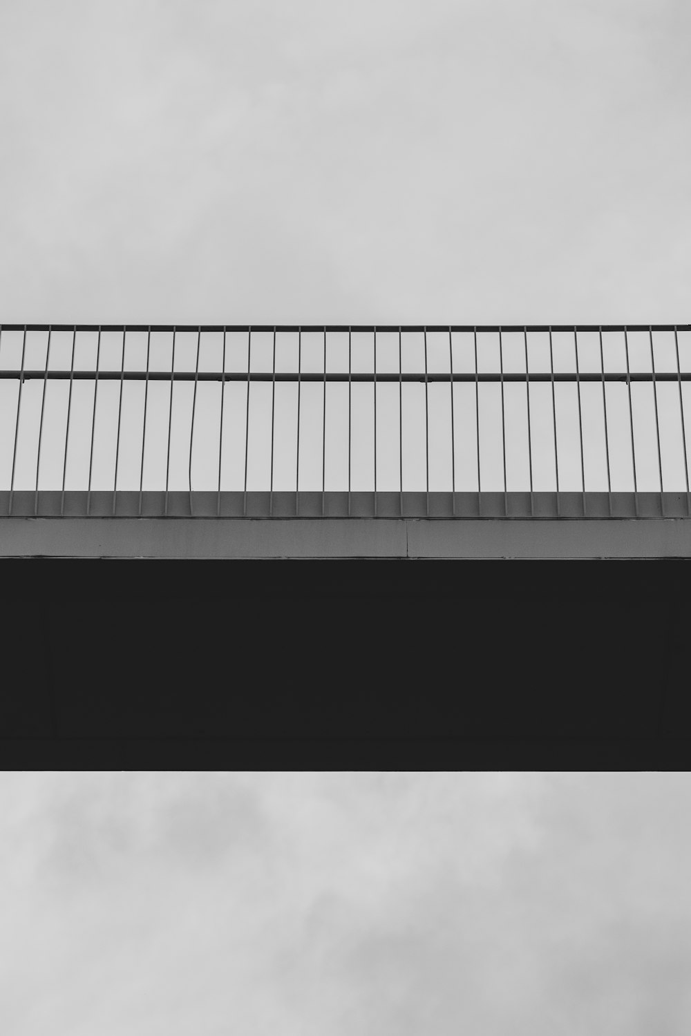 low-angle photography of gray concrete bridge