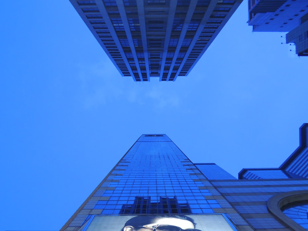 low-angle photography of curtain wall building