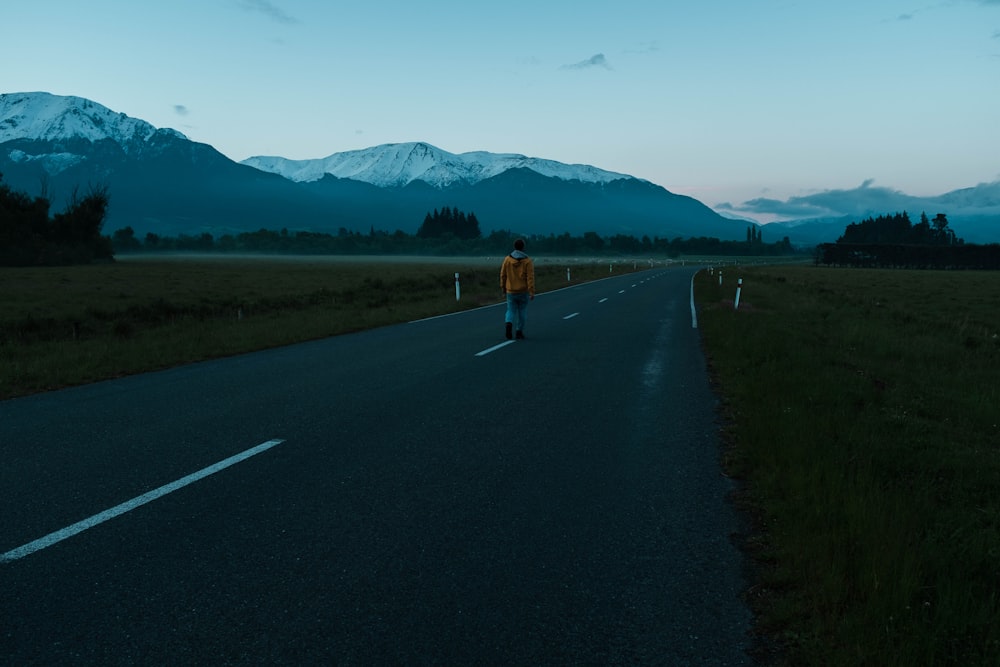 person walking on road during daytime