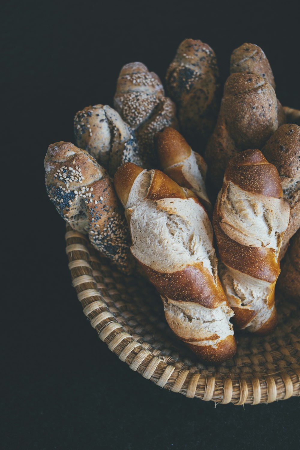 baked bread on brown wicker bowl