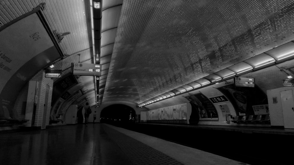 grayscale photography of train station