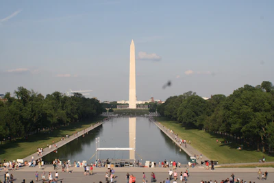 Iconic national landmarks under a clear sky, buzzing with visitors exploring culture