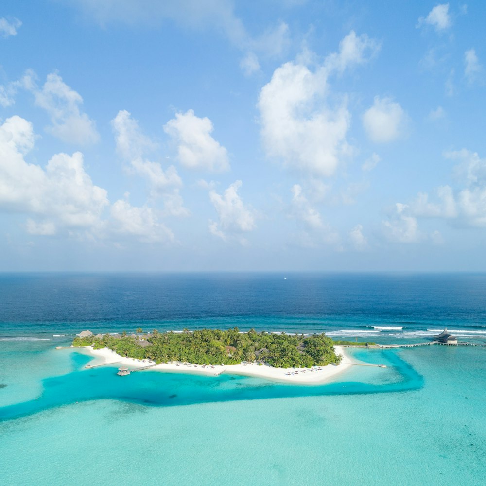 boat near island under blue sky