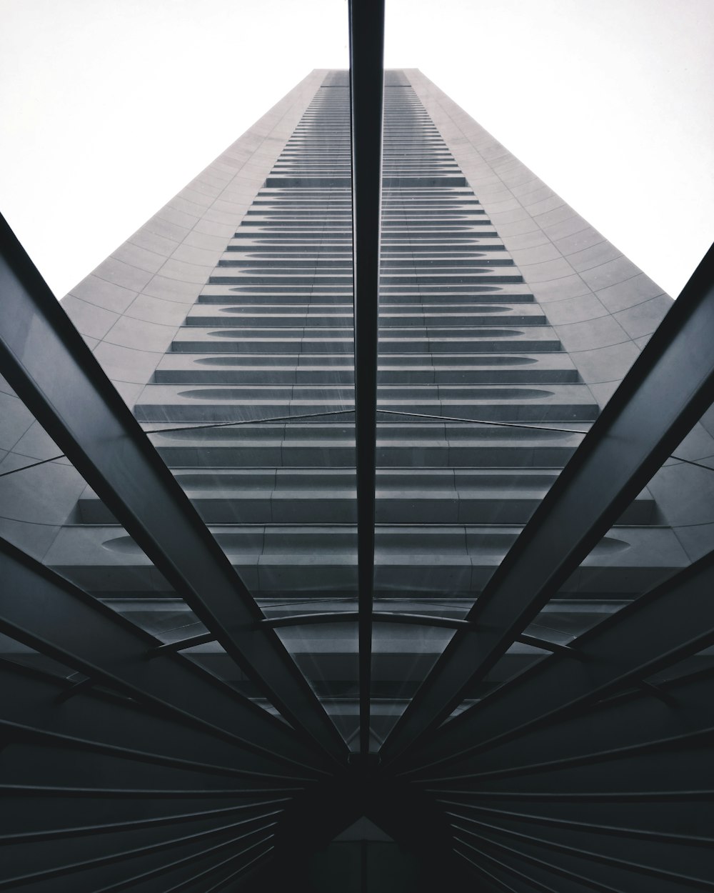 low-angle photo of grey high-rise building